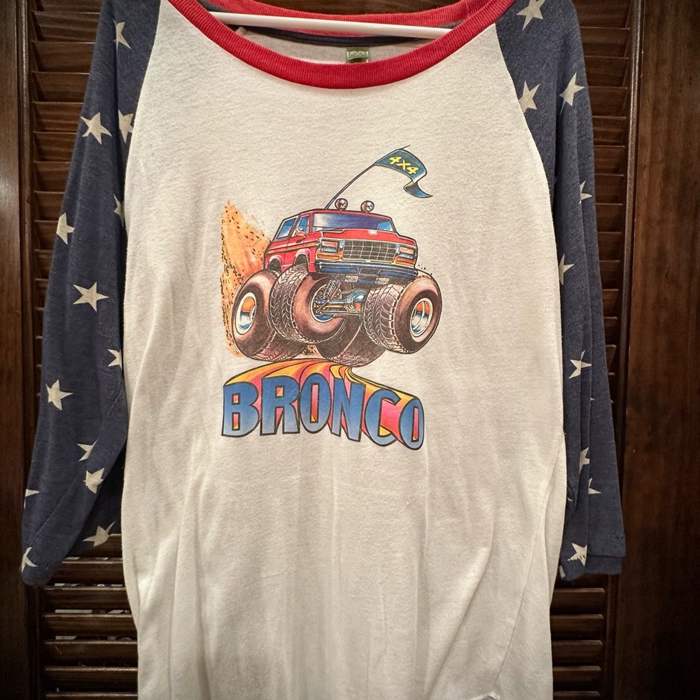 Ringer jersey style cartooned graphic 3/4 sleeve shirt